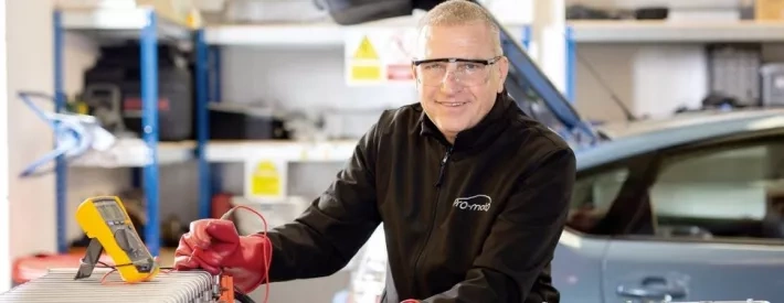 Technician working on battery
